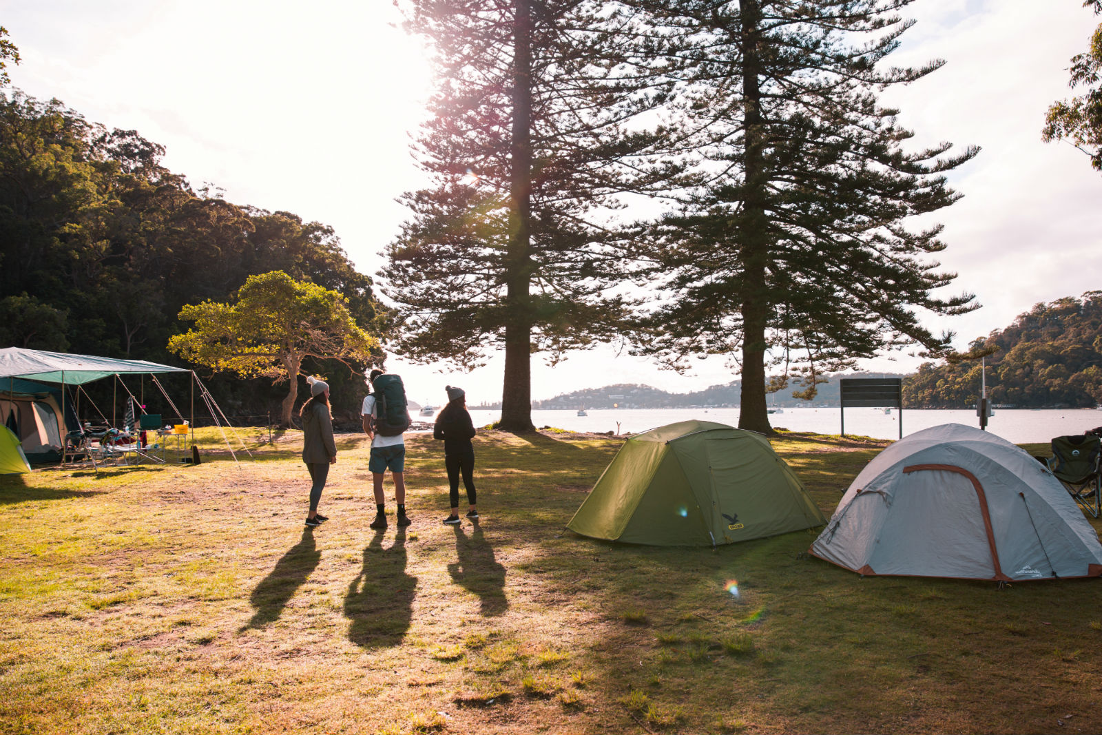 Group of campers and tents at The Basin campground, Ku-ring-gai Chase National Park. Photo credit: Tim Clark / DPE