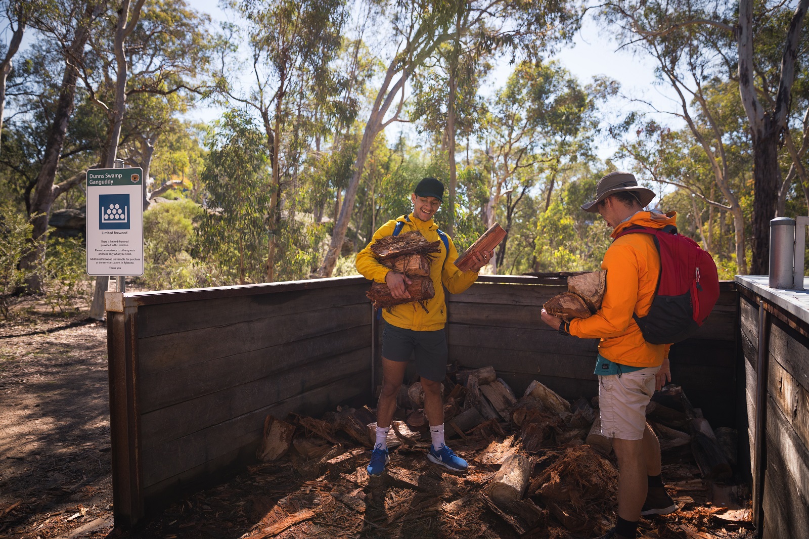 Two people collecting firewood at Ganguddy-Dunns Swamp campground in Wollemi National Park. Photo credit: Daniel Tran/DPIE