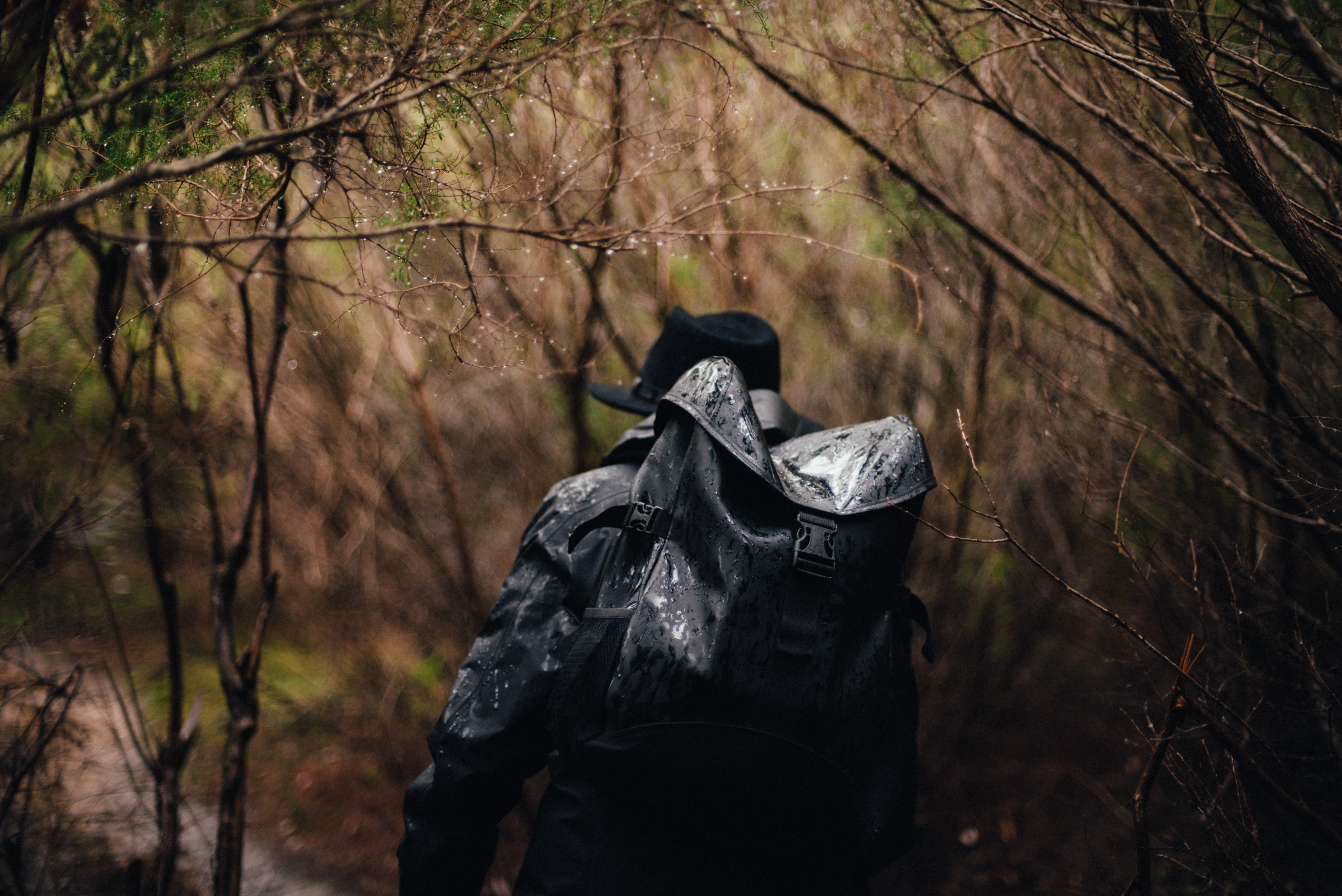 Man with backpack hiking through Blue Mountains National Park. Photo: © Adrian Mascenon @adrianmascenon