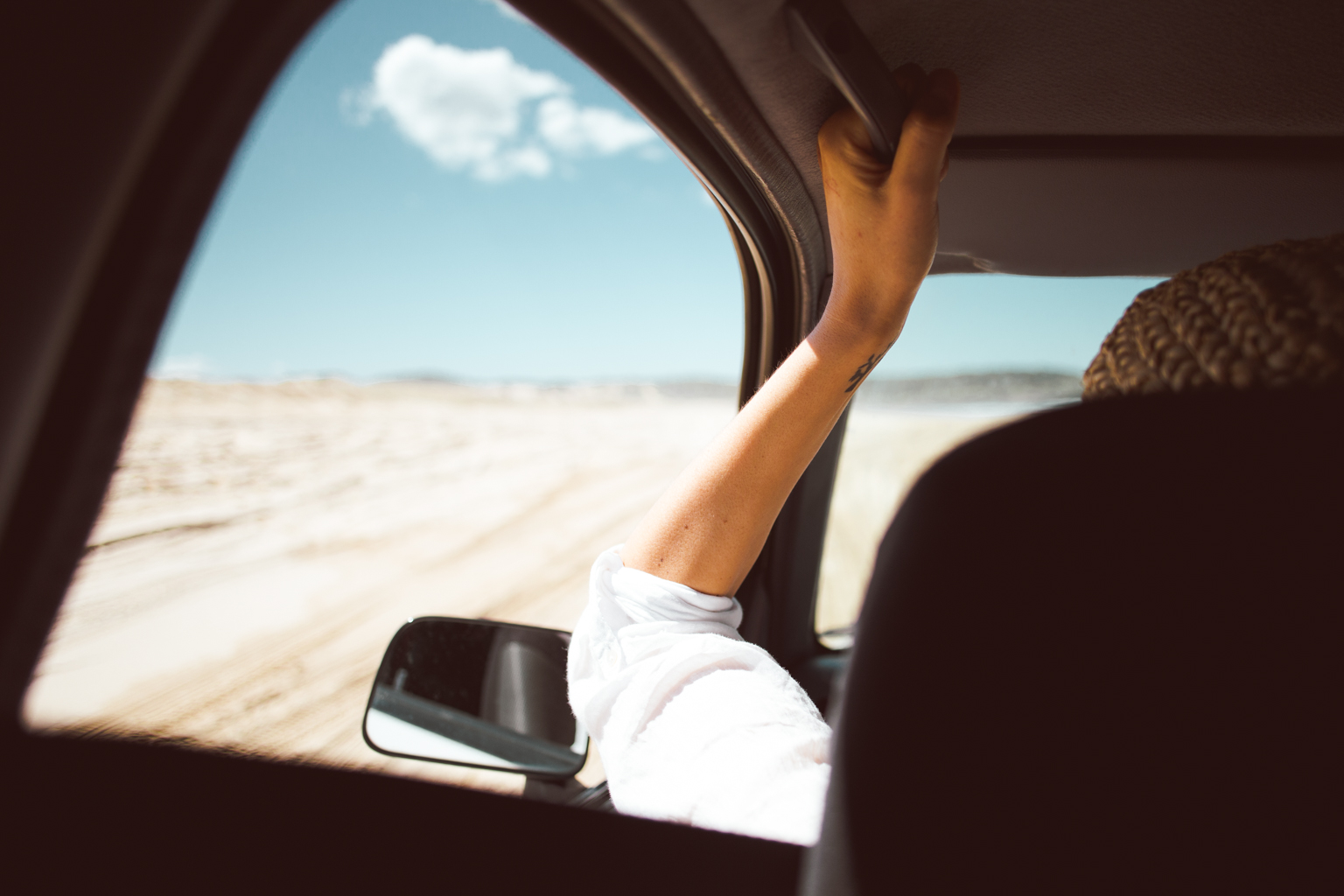 People driving on the sand dunes. Photo: Tim Clark