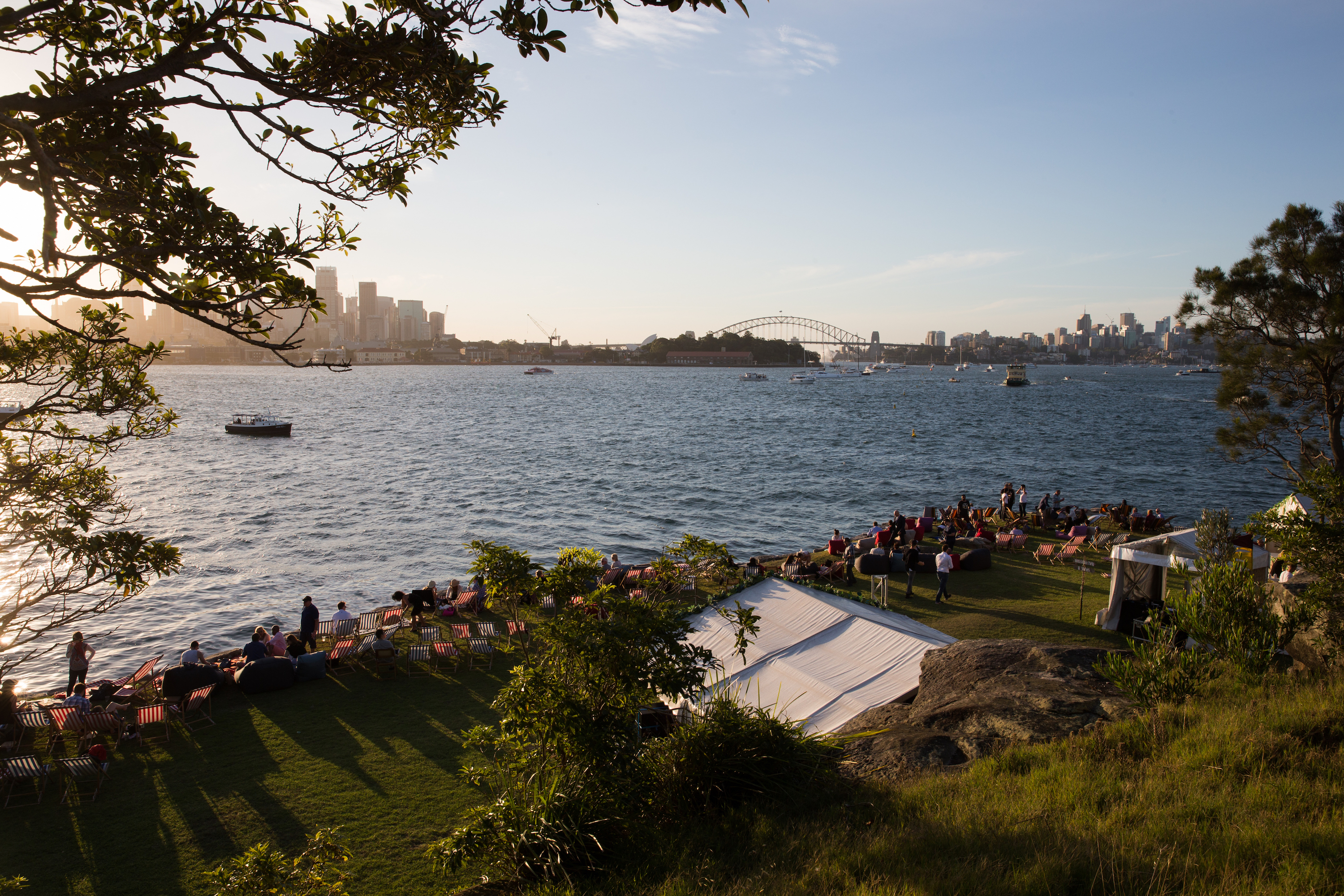 People relaxing before the Sydney Harbour New Year's Eve fireworks at Clark Island, Sydney Harbour National Park. Photo: Edwina Pickles/DPIE