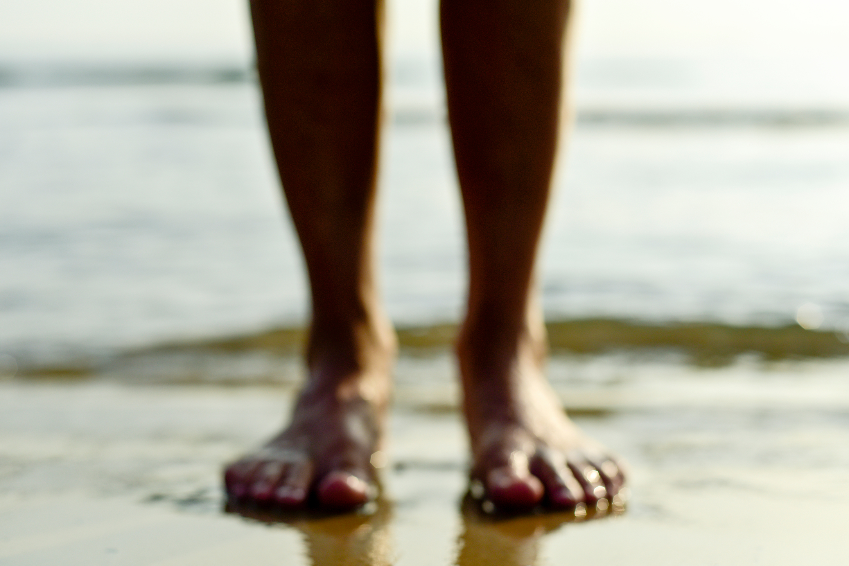 Generic image of feet in the sand