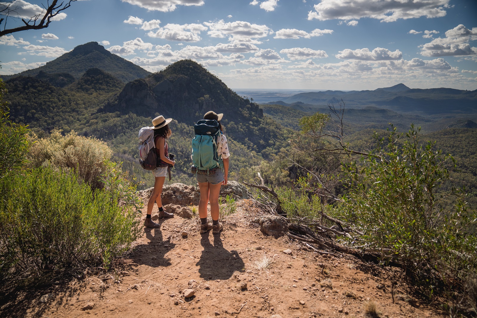 Two hikers on Breadknife and Grand High Tops walk in Warrumbungle National Park. Photo credit: Rob Mulally/DPIE