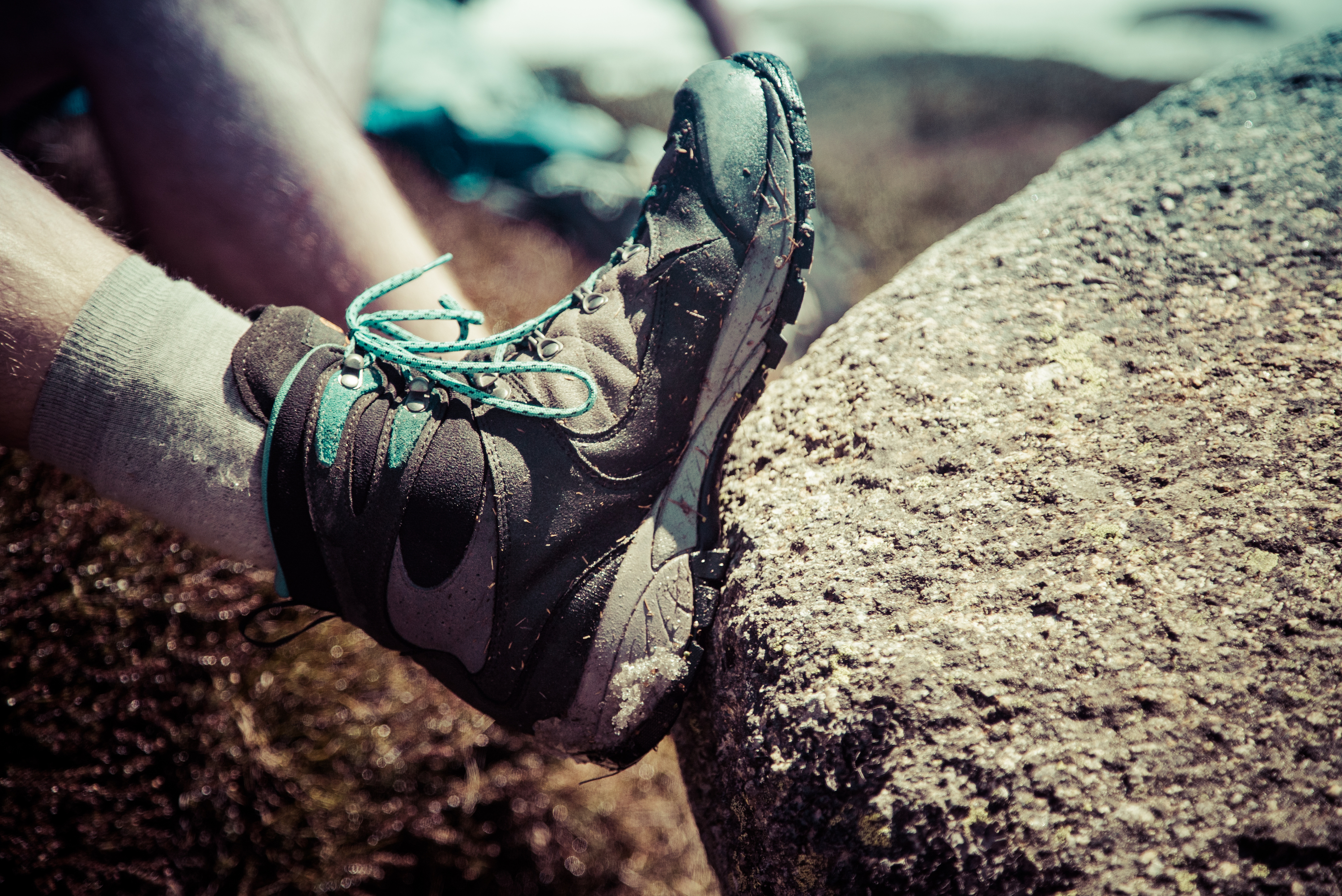 Close-up view of a hiker's boot. Photo: Person admiring view of Snowy Mountains, Kosciuszko National Park. Photo: Daniel Parsons/DPIE
