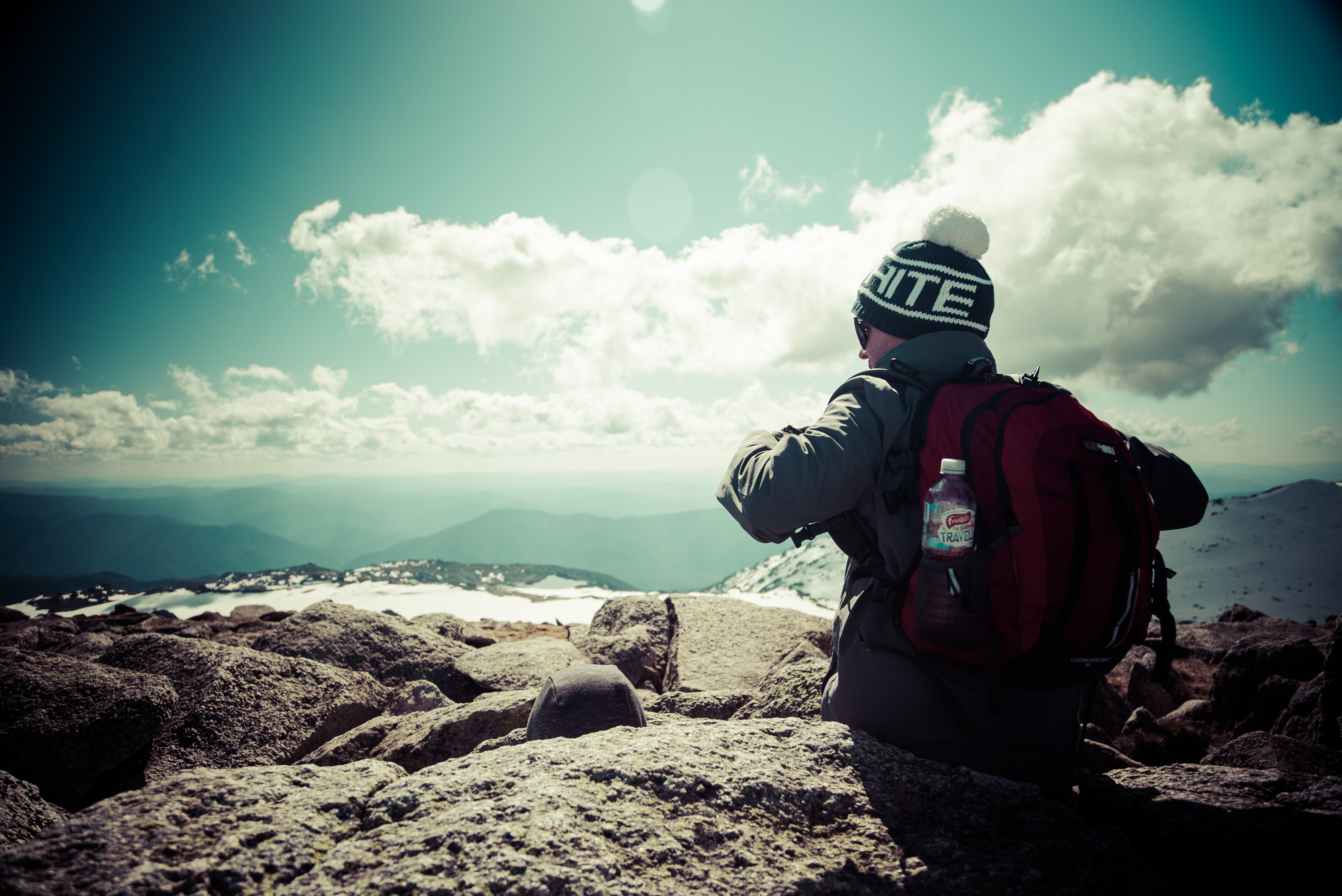 Person admiring view of Snowy Mountains, Kosciuszko National Park. Photo: Daniel Parsons/DPIE