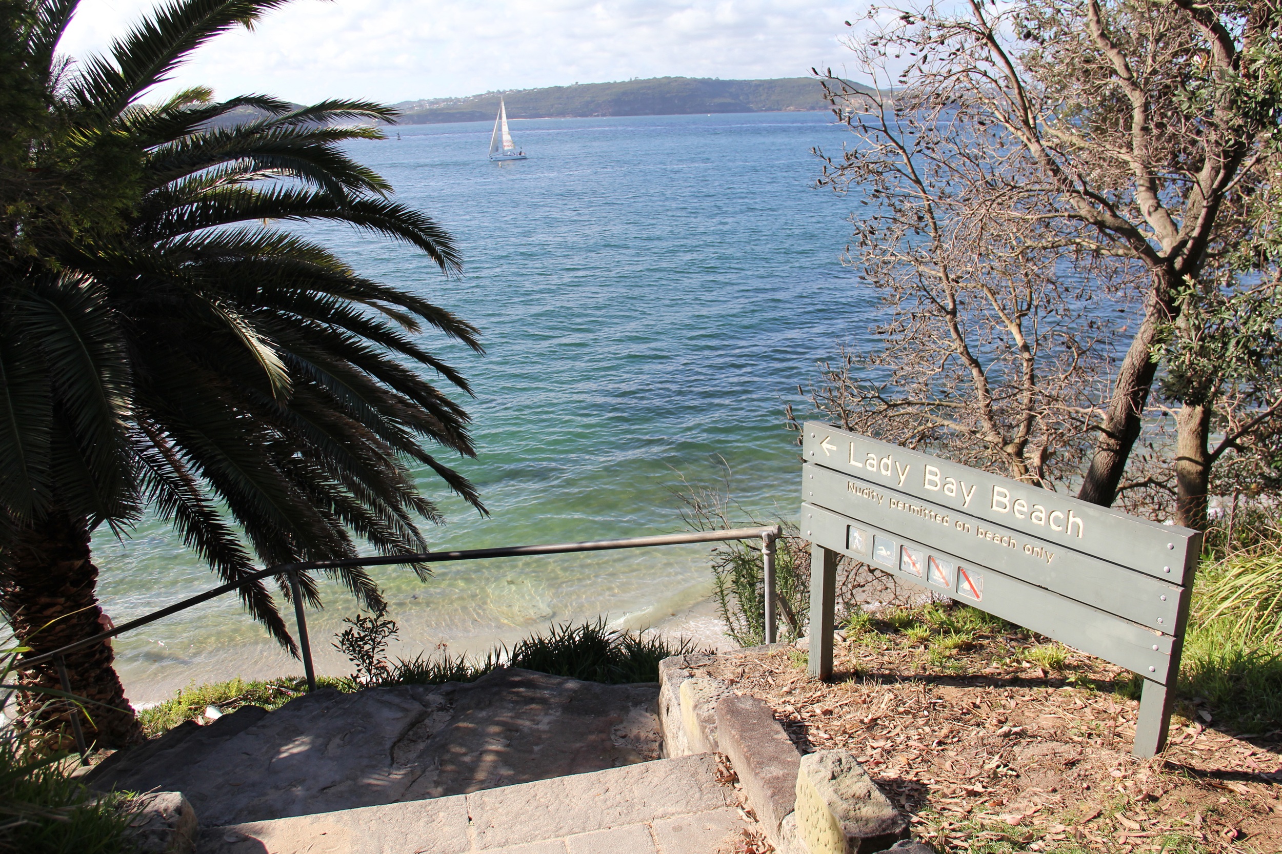 The stairs and sign leading to Lady Bay Beach.