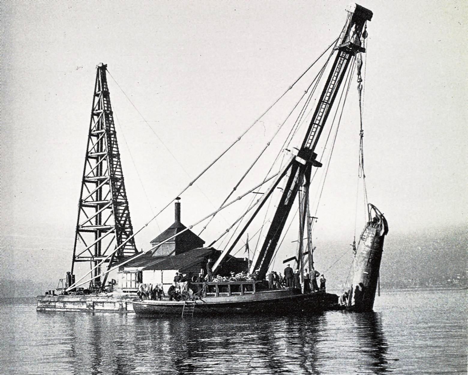 An historical image of a Japanese midget submarine M-22 being raised from Taylor's Bay, Sydney, 1942. Photo: DCCEEW
