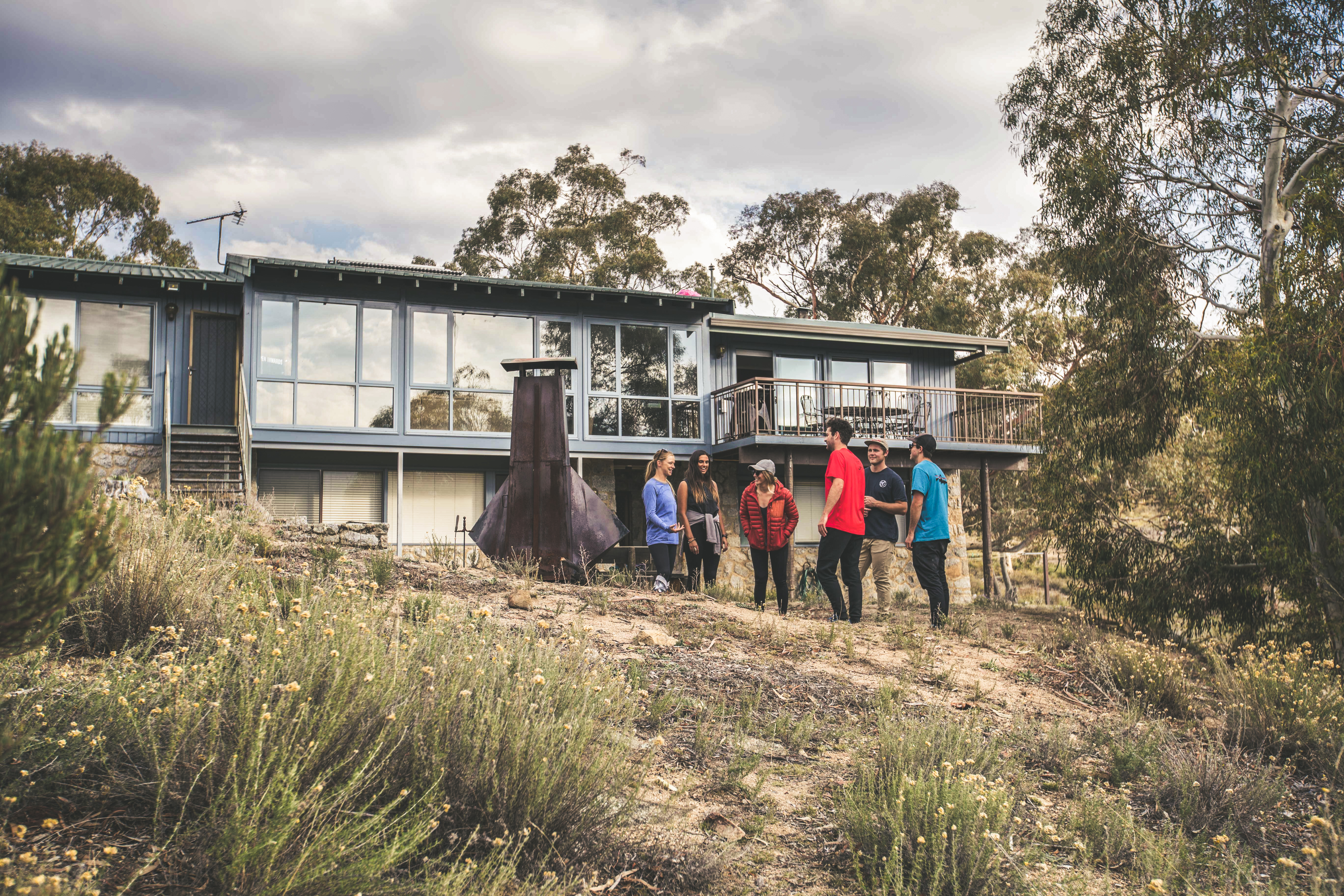 Group of people outside Creel Lodge in Kosciuszko National Park. Photo credit: Boen Ferguson/DPIE