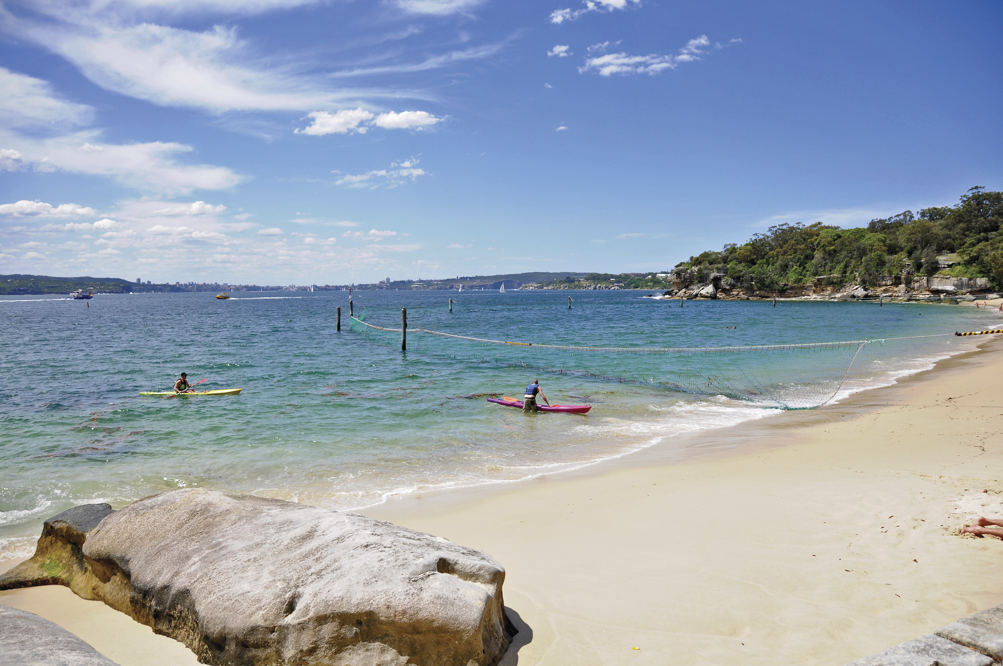People kayaking at Shark Beach in Sydney Harbour National Park. Photo credit: Kevin McGrath/DPIE