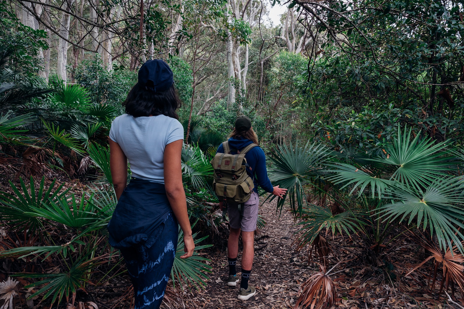 Two people walking through Murramarang National Park. Photo credit: Melissa Findley/DPIE