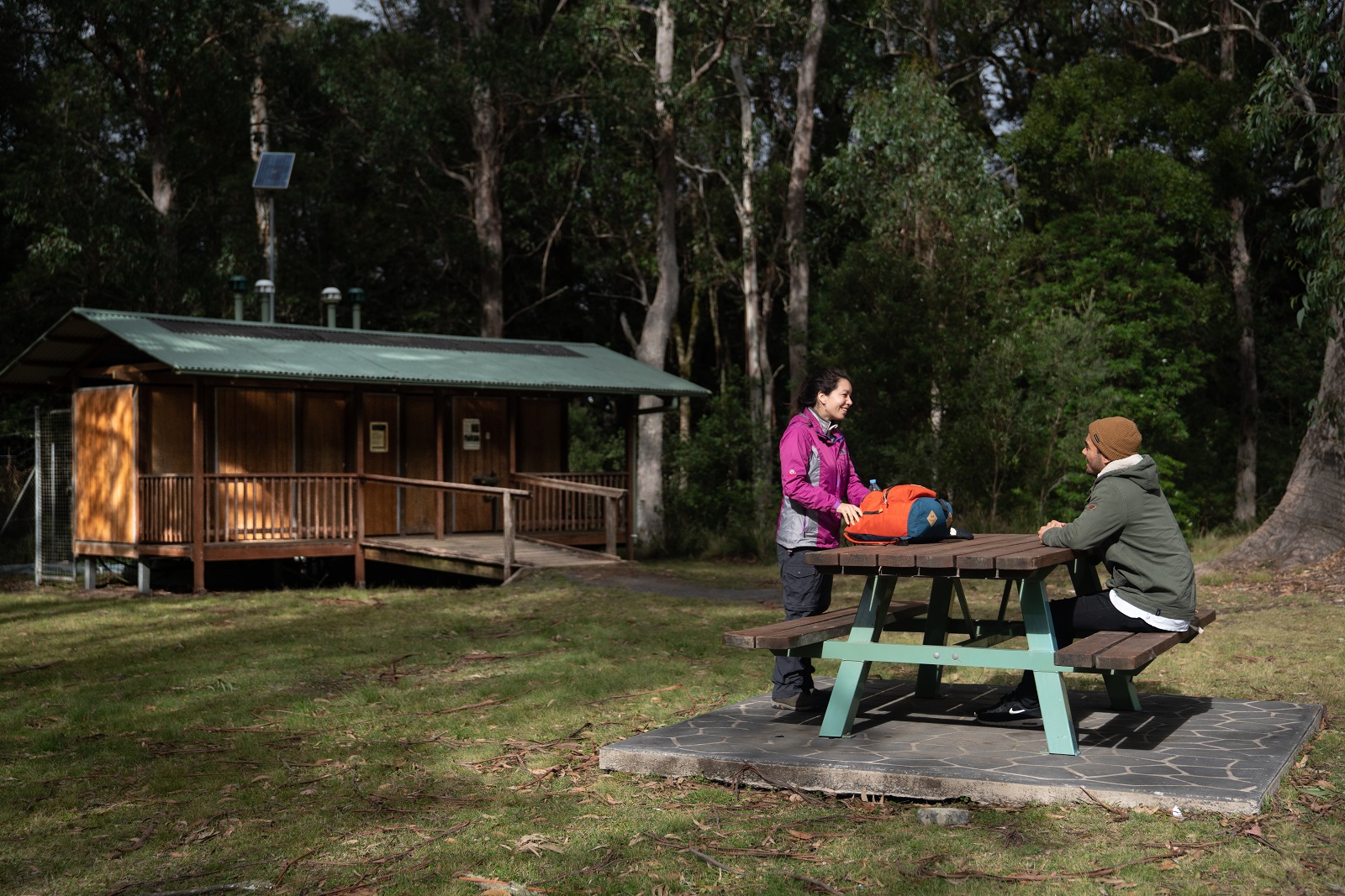 Couple resting at Honeysuckle picnic area in Barrington Tops National Park. Photo credit: Rob Mulally/DPIE