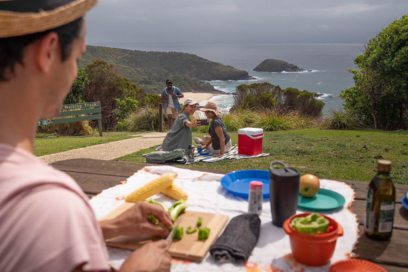 Group of people having a picnic at Hat Head National Park. Photo credit: Rob Mulally/DPIE
