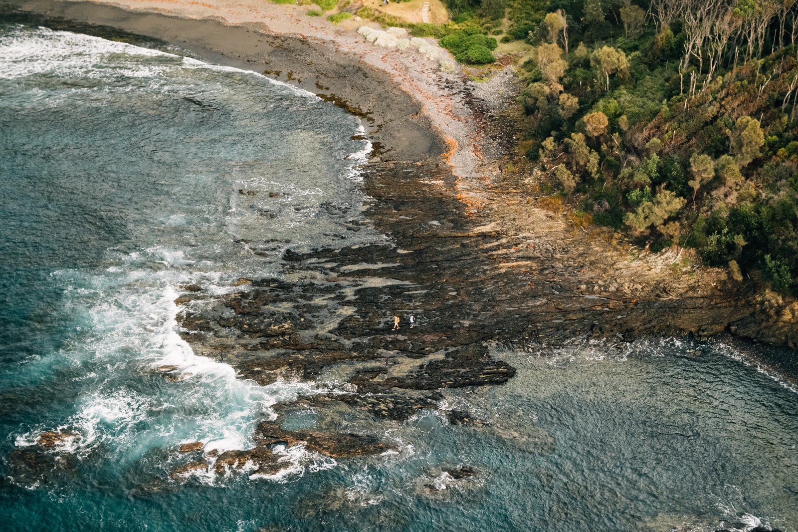 People walking along Murramarang National Park coastline. Photo credit: Melissa Findley/DPIE
