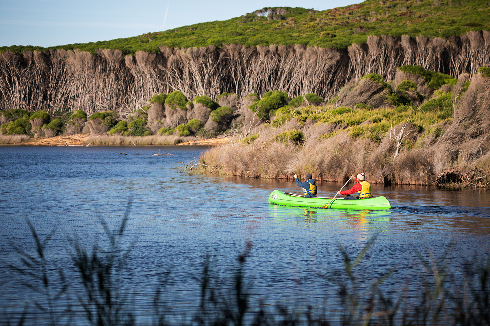 Two people canoeing in the lagoon at Hobart Beach, Bournda National Park. Photo credit: Daniel Tran/DPIE