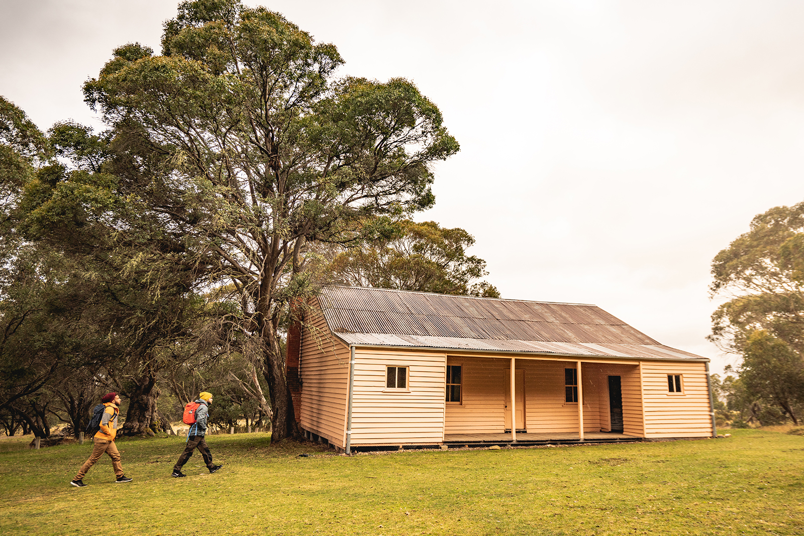 Two guys walking towards Long Plain Hut campground, High Plains area in Kosciuszko National Park. Photo credit: Rob Mulally/DPIE