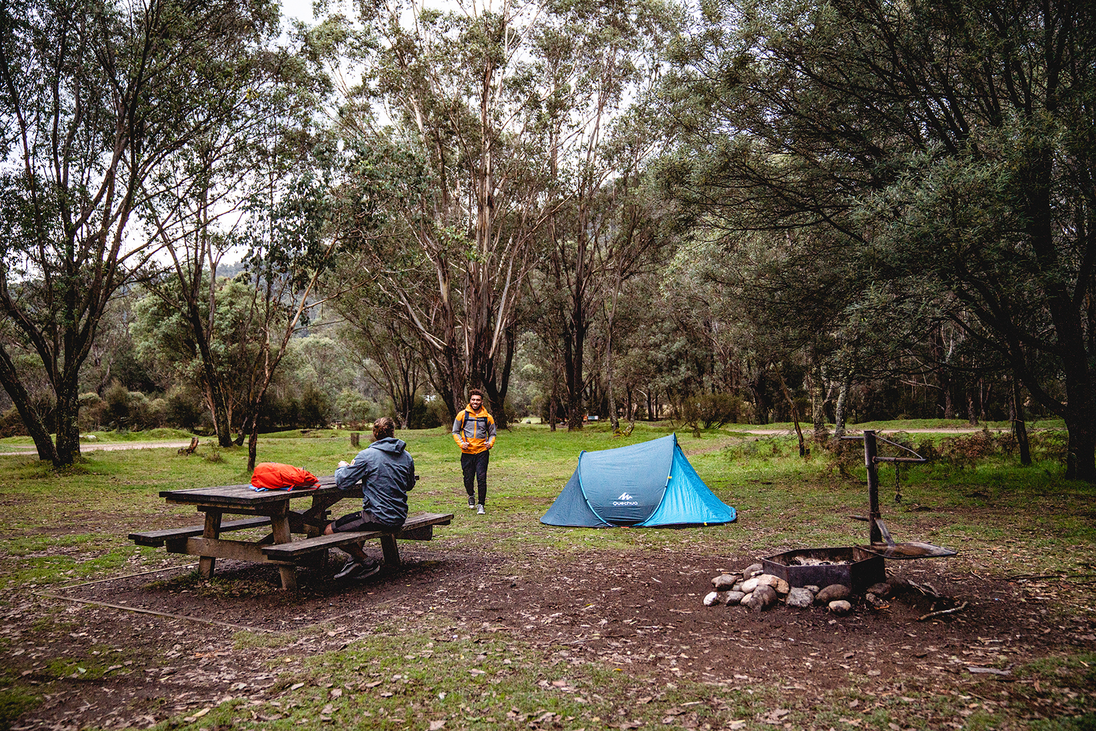 Two guys greeting each other at Geehi Flats campground, Khancoban area in Kosciuszko National Park. Photo credit: Rob Mulally/DPIE