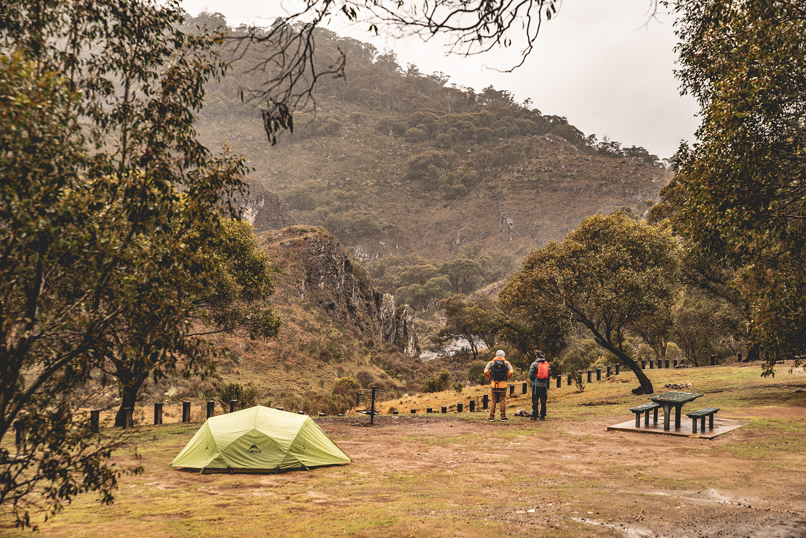 Two people looking at Clarke Gorge from Blue Waterholes campground, High Plains area in Kosciuszko National Park. Photo credit: Rob Mulally/DPIE