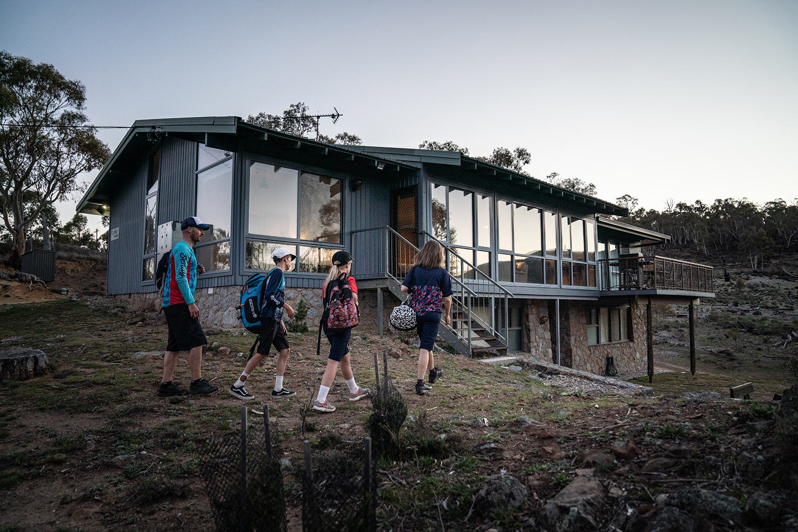 Family of four walking to Creel Lodge, Thredbo-Perisher area in Kosciuszko National Park. Photo credit: Boen Ferguson/DPIE