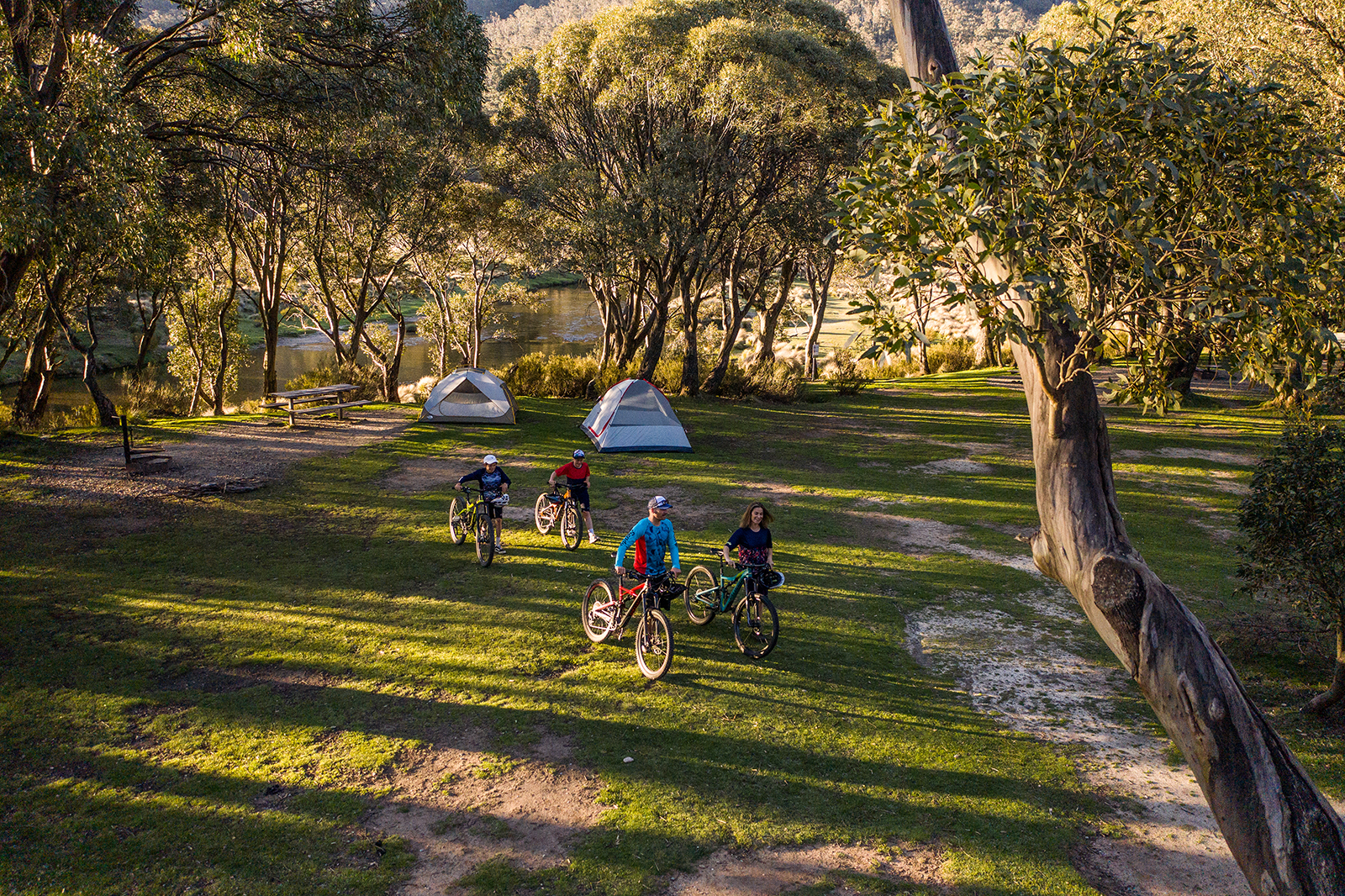 A family of four camping in Thredbo Diggings campground, Thredbo-Perisher area in Kosciuszko National Park. Photo credit: Rob Mulally/DPIE