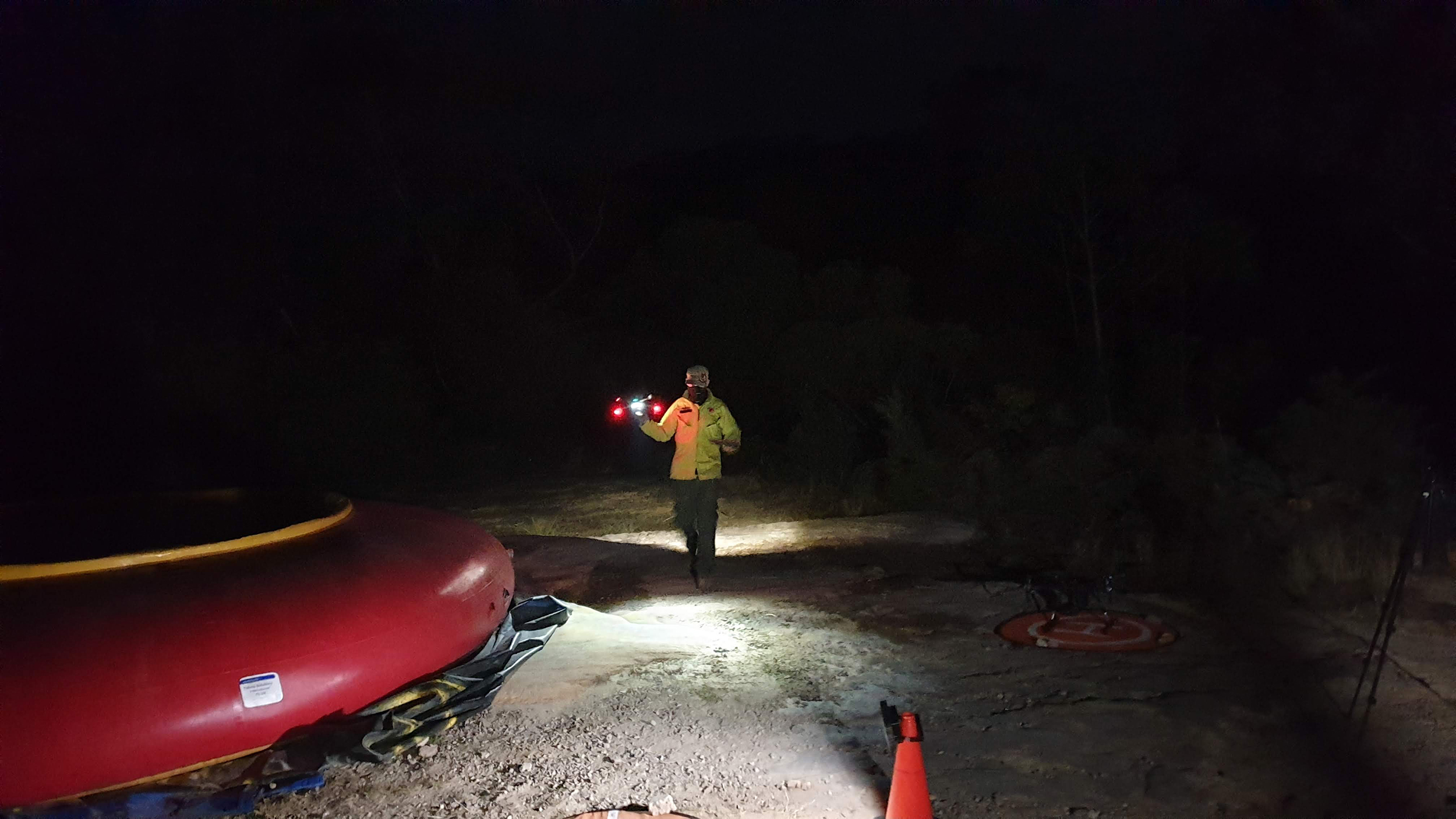 NSW National Parks Drone pilot with drone at night. Photo: Scott Colefax / DCCEEW  © Scott Colefax