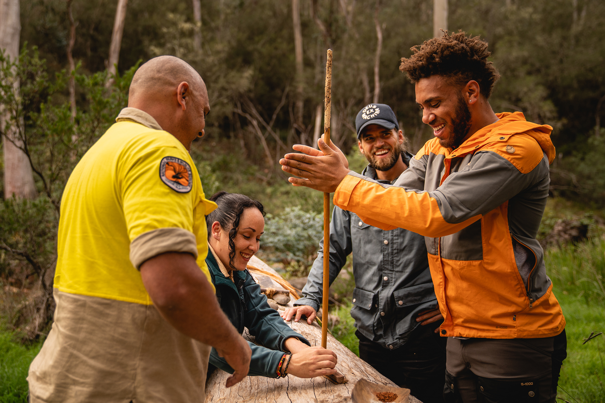 Two people are shown some Walgalu practices by the Walgalu County Traditional Custodians. Walgalu Country. Kosciuszko National Park. Photo credit : Rob Mulally / DPE