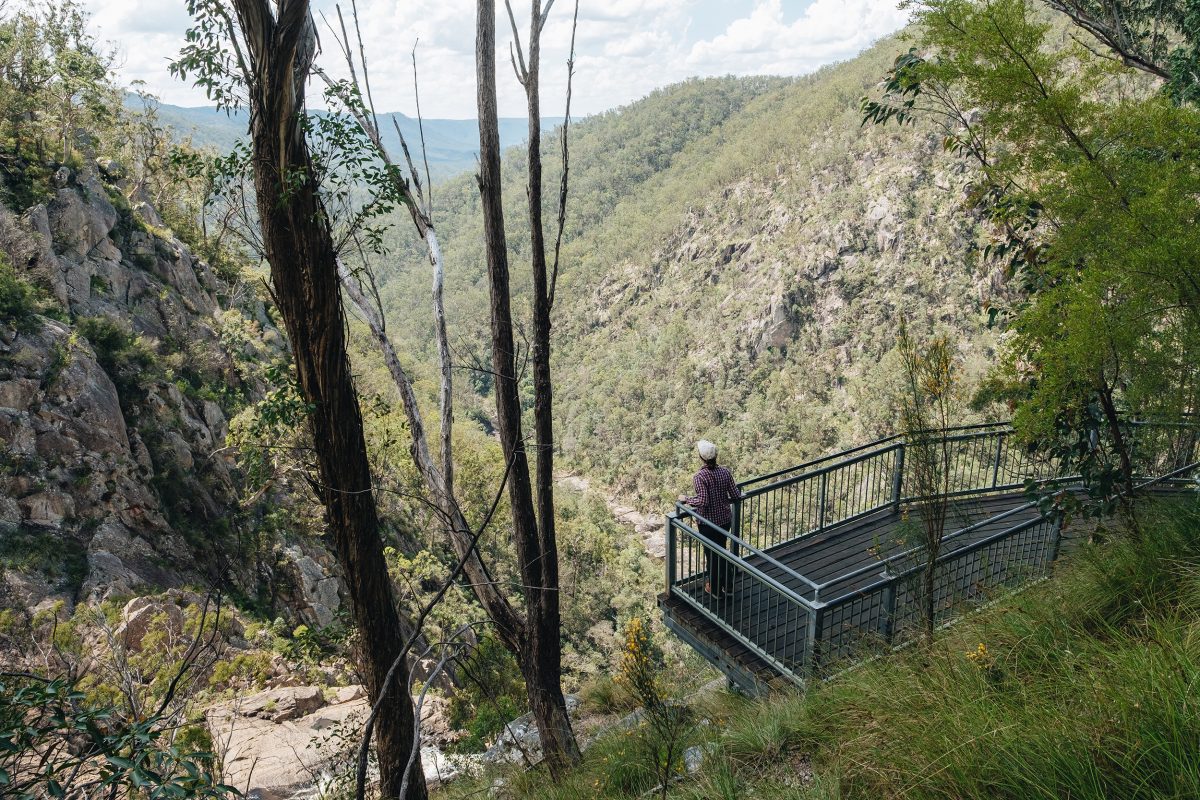 Standing at the lookout overlooking the valley at Boonoo Boonoo Falls lookout. in Boonoo Boonoo National Park. Photo credit: Harrison Candlin / DPE