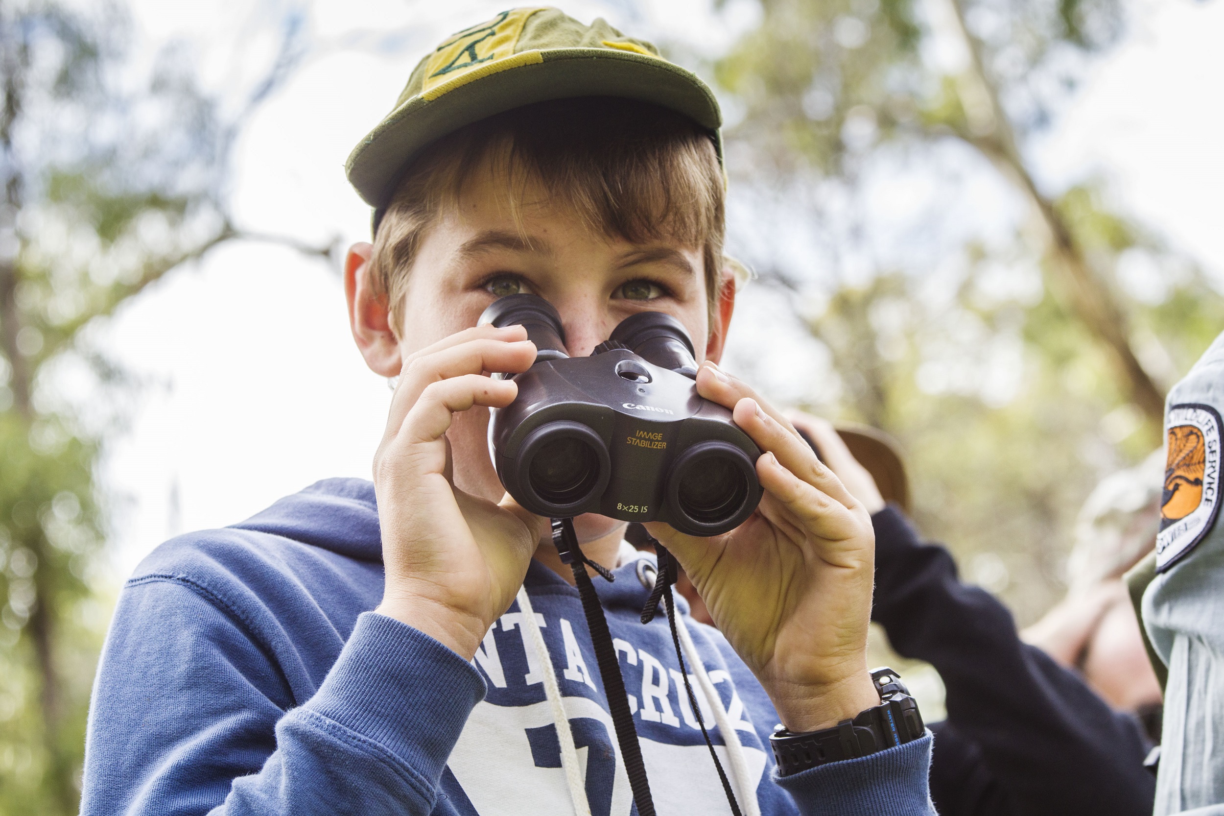 Child with binoculars.