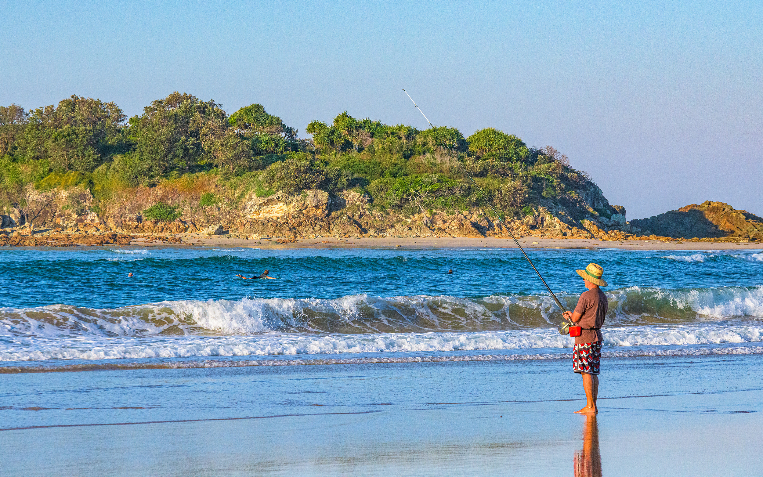 Person fishing from the beach. Photo credit: Jessica Robertson / DPE
