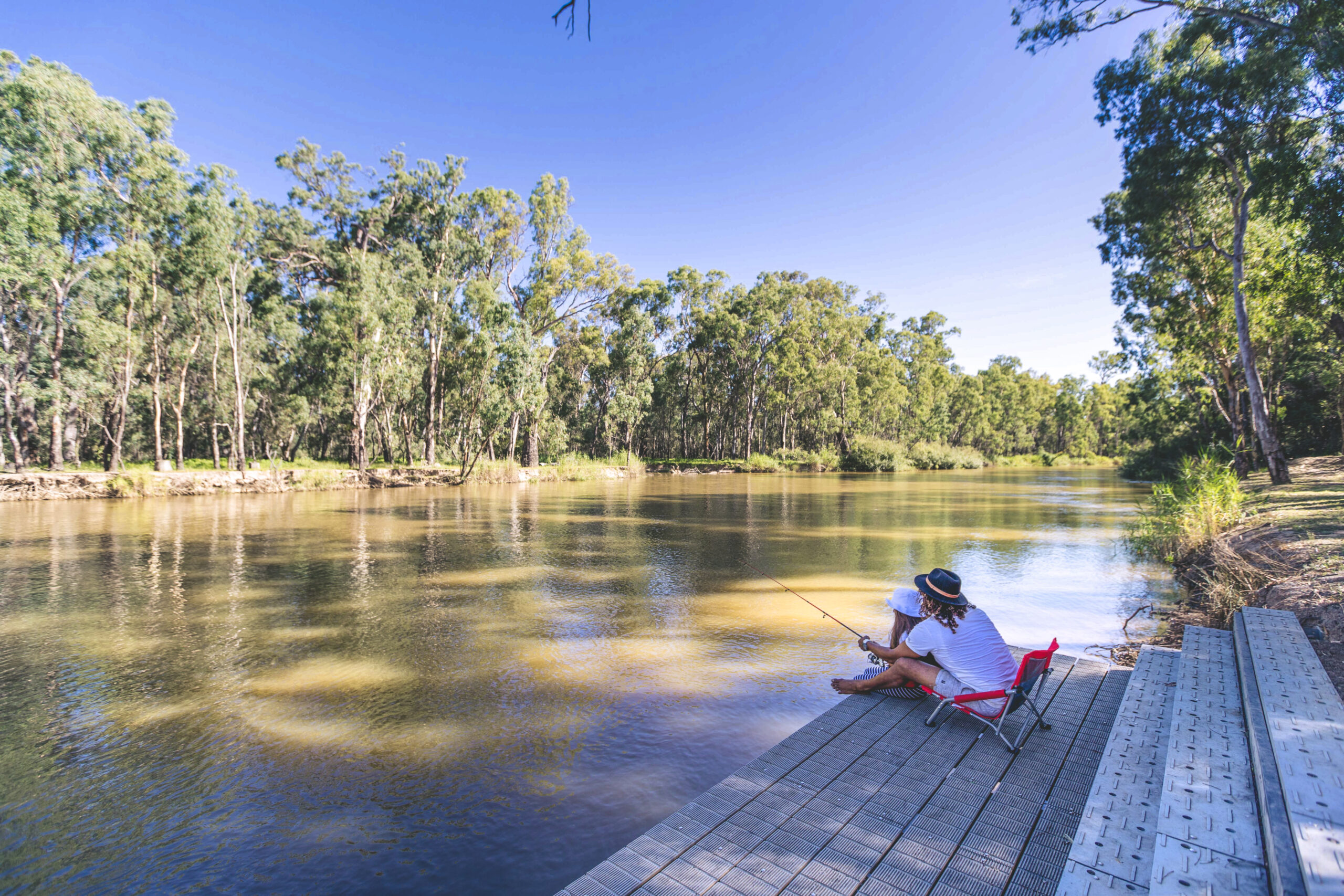 Couple fishing at Swifts Creek Campground. Photo credit: Boen Ferguson / DPE