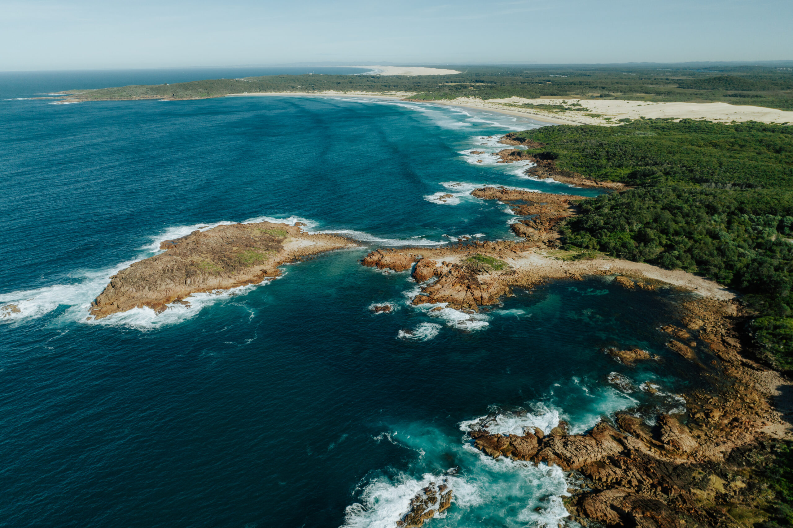 Aerial of the Tomaree National Park coast line. Photo: Remy Brand / DCCEEW © Studio Bilby
