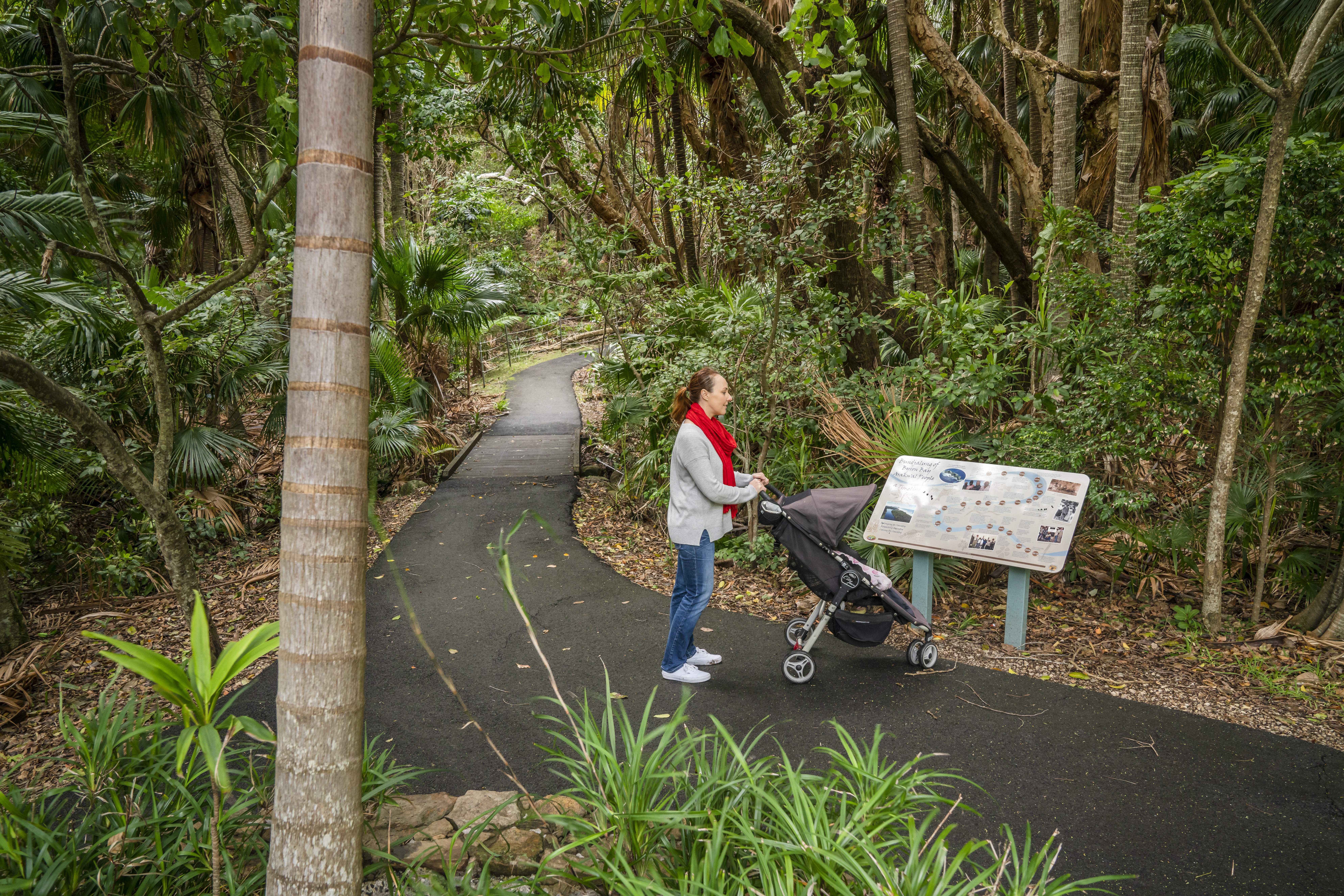 Woman with pram on Palm valley loop track. Photo credit: John Spencer / DPE