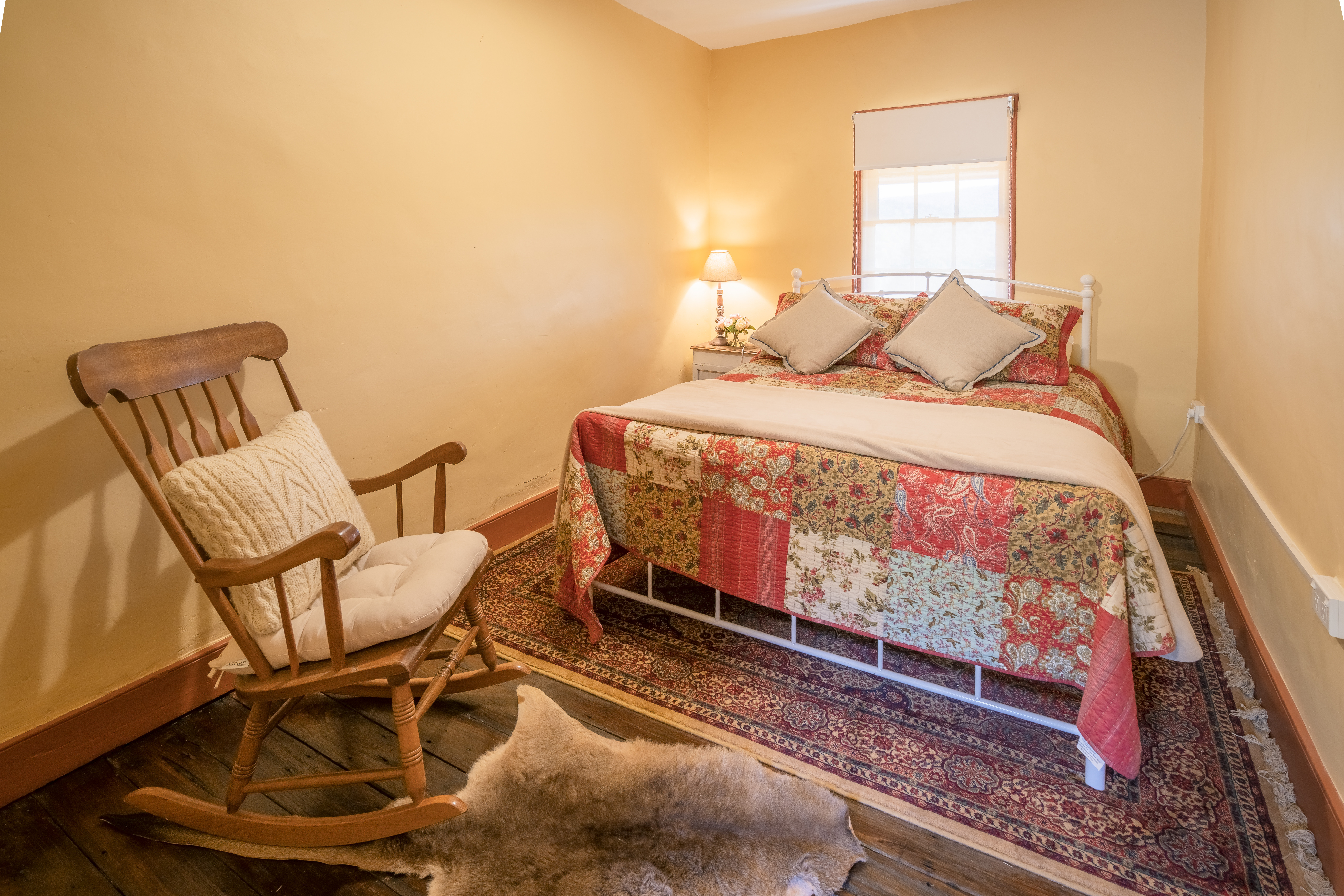 A cozy bedroom in Old Trahlee cottage. Photo credit: John Spencer/DCCEEW