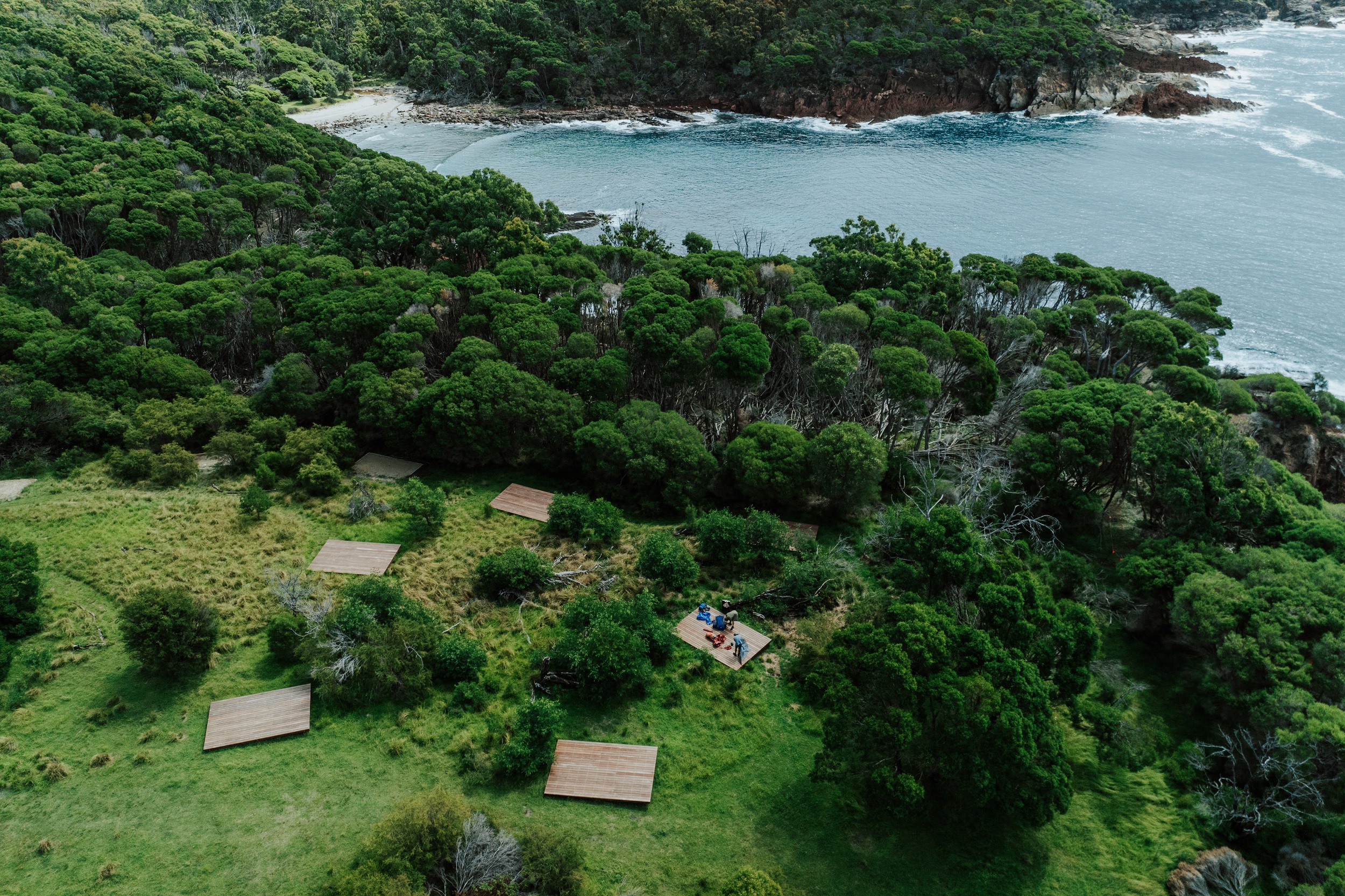 An aerial veiw of the camping platforms at Mowarry Campground on the Light to Light Walk. Photo: Daniel Parsons/DCCEEW © Studio Bilby