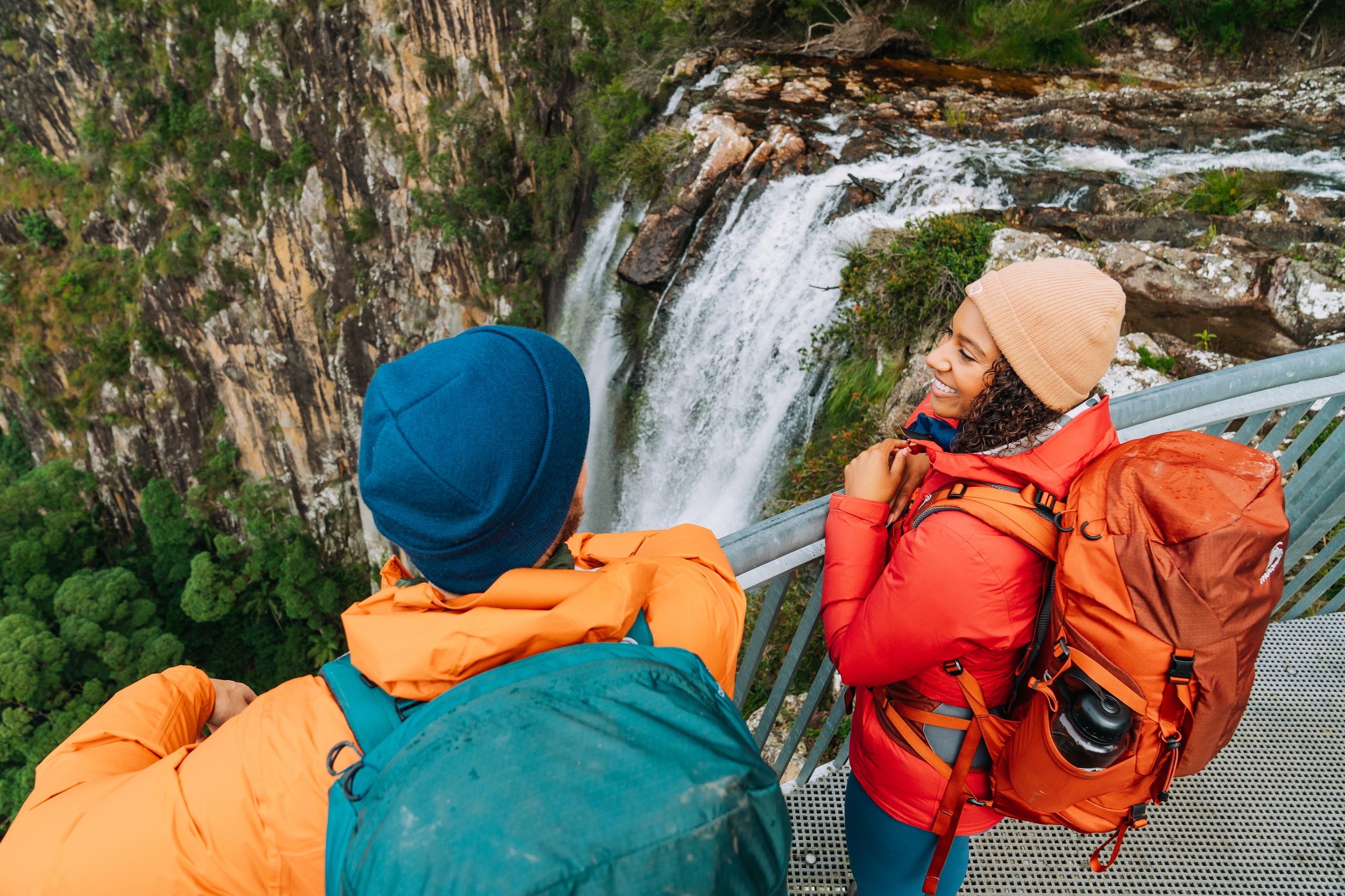 Two hikers check out the epic view from Minyon Falls lookout. Photo: Remy Brand/DCCEEW © Studio Bilby