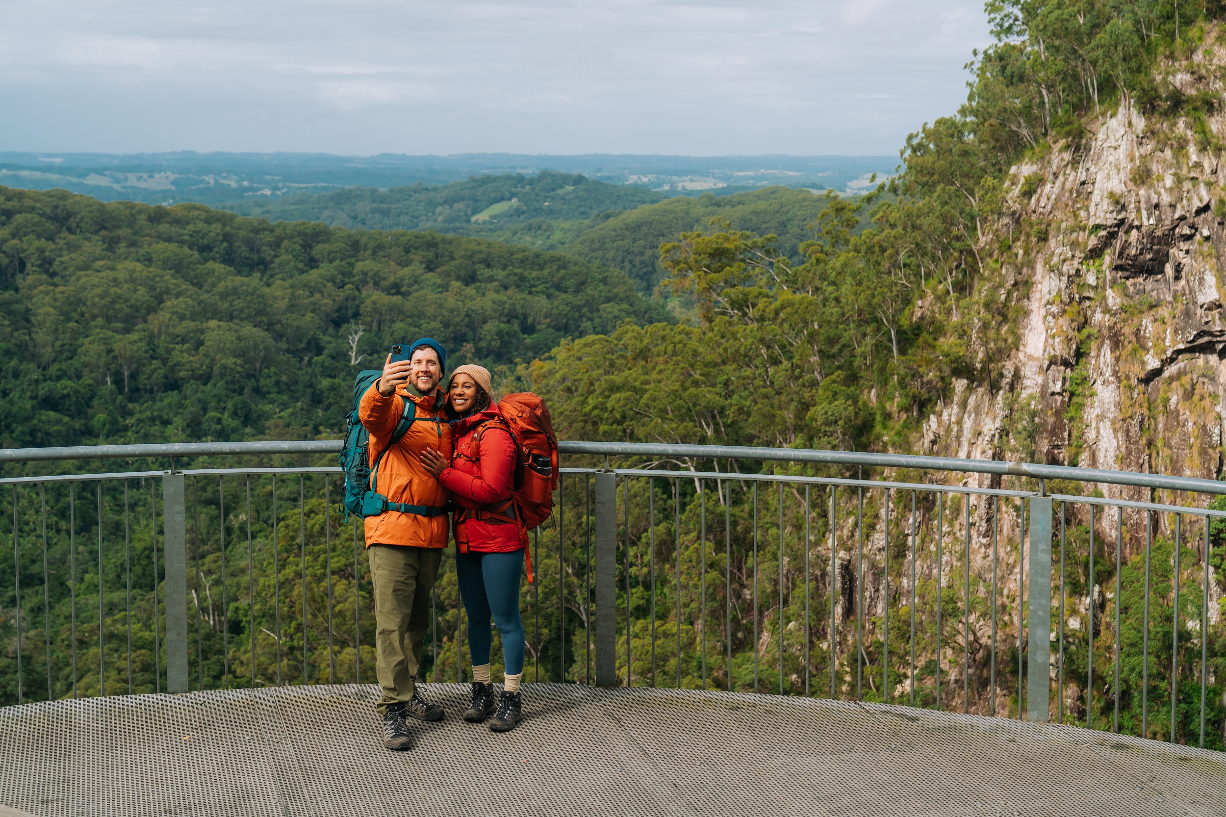Two hikers take a selfie at Minyon Falls lookout. Photo: Remy Brand/DCCEEW © Studio Bilby