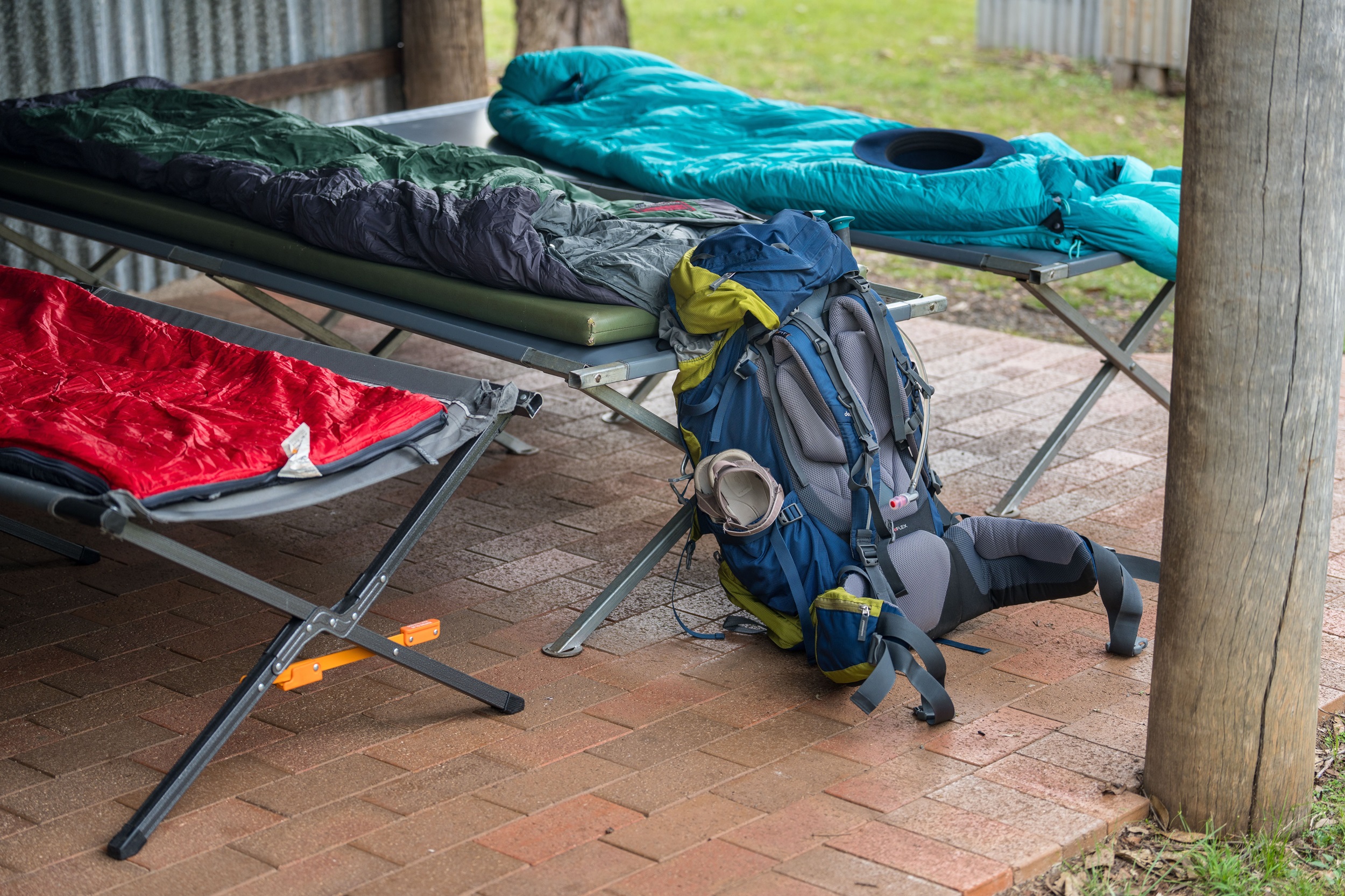 Camping beds set up at a heritage hut on Green Gully Track.