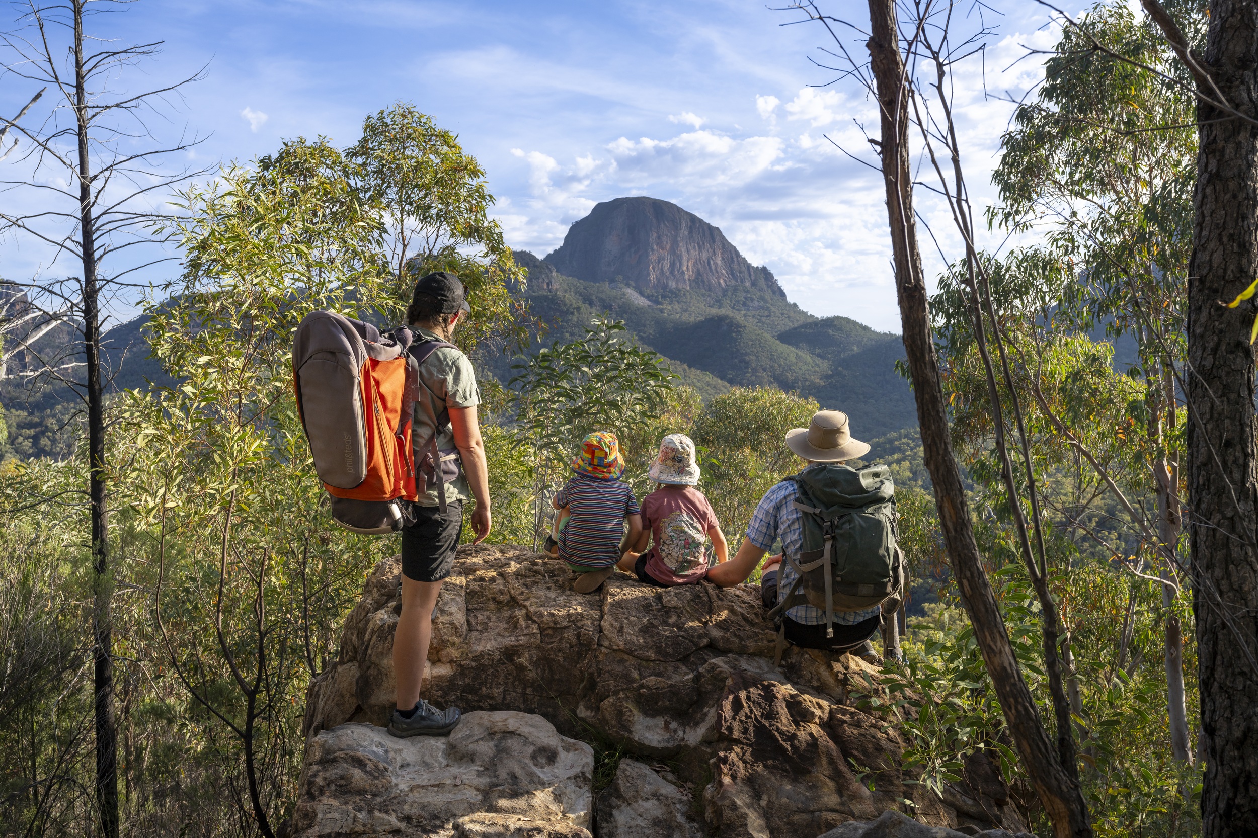 A family taking in the view from Fan Horizon walking track in Warrumbungle National Park.