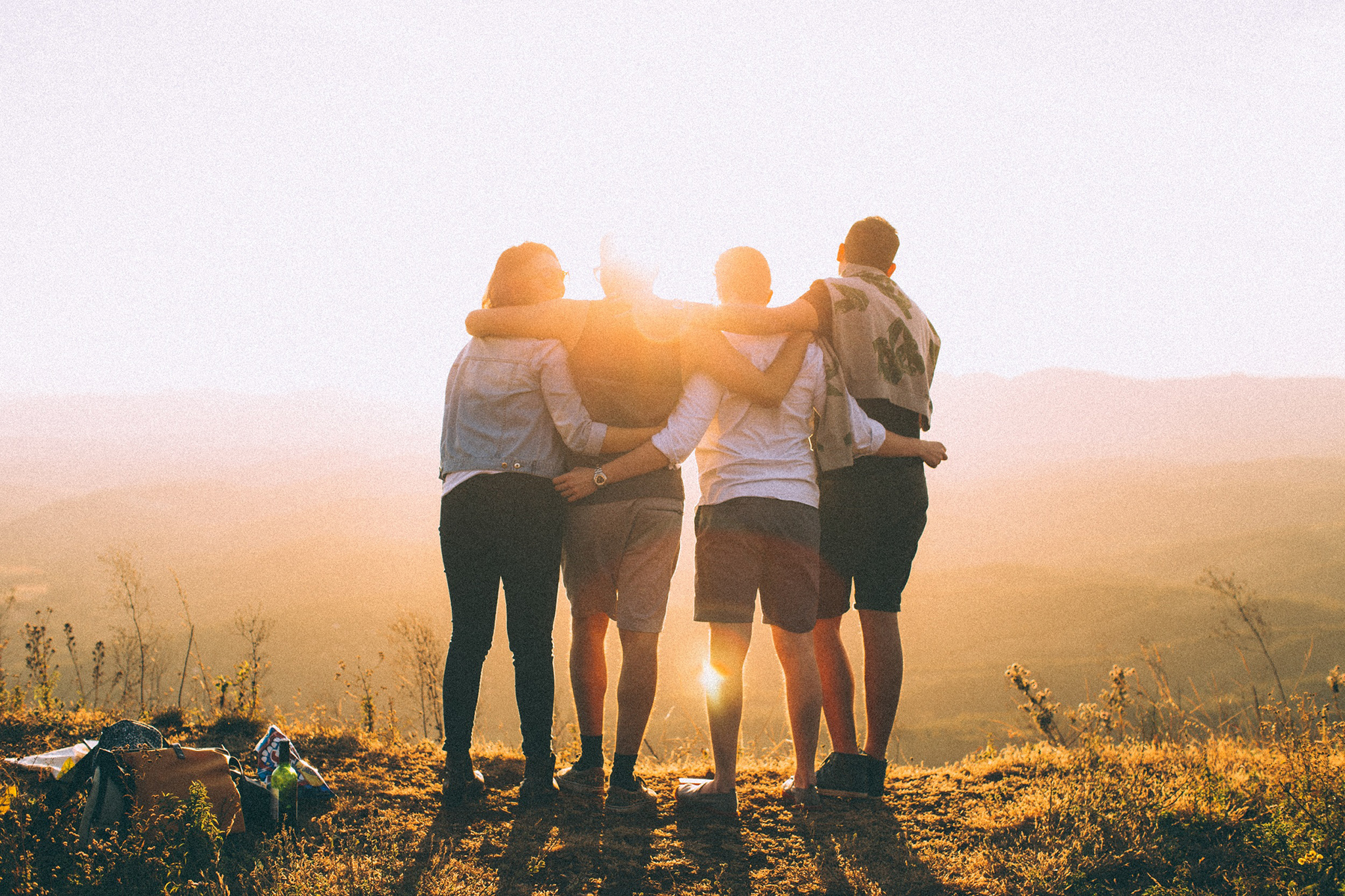 Group of people embracing in a NSW national park. Photo: Pexels/Helena Lopez © Pexels
