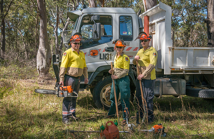Field officers at Tomaree National Park by their work truck and tools. Credit: John Spencer &copy; DCCEEW