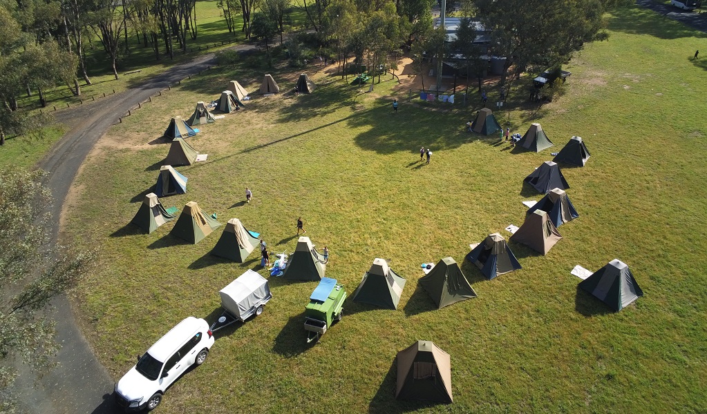 Aerial shot of students' tents pitched in a ring on the grass, ready for an overnight stay beside Warrumbungle National Park Environmental Education Centre. Credit and &copy; Warrumbungle National Park Environmental Education Centre 