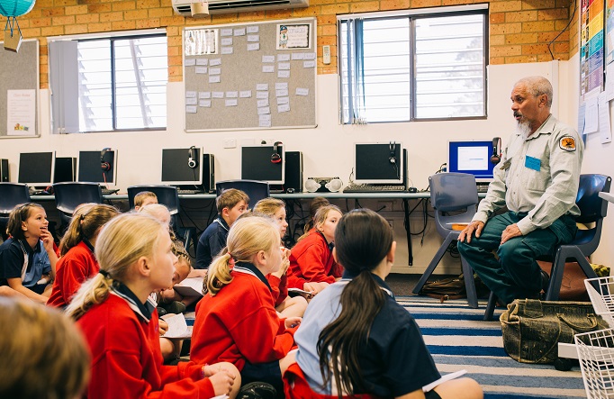 An Aboriginal NPWS educator leading an incursion at Coffs Harbour Christian Community School, 2019. Photo: Jay Black &copy; NPWS