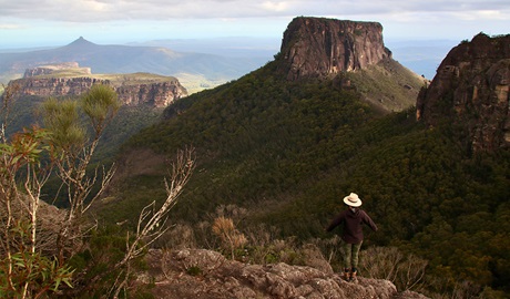 A hiker looking out over the Castle in Morton National Park. Credit: Chris Zinon &copy; Big Nature Adventures