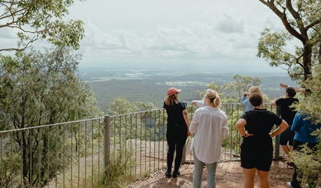 People at a lookout on a guided tour with Mawambul in Sugarloaf State Conservation Area, near Newcastle. Credit: Larissa Gray &copy; Larissa Cluff Creative