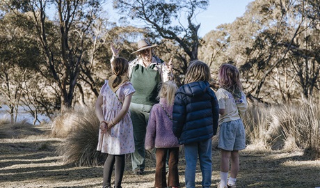 A Discovery ranger showing kids through the bush on a guided tour. Credit: Breanna A Photography &copy; DCCEEW
