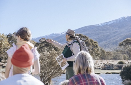 A NPWS tour guide leading a group through bushland in Kosciuszko National Park. Credit and &copy; Tourism Snowy Mountains/Breanna A Photography 