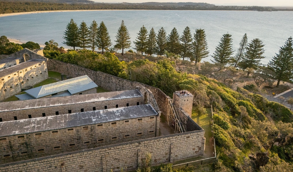 An aerial view of Trial Bay Gaol in Arakoon National Park at sunset. Credit: John Spencer &copy; DCCEEW