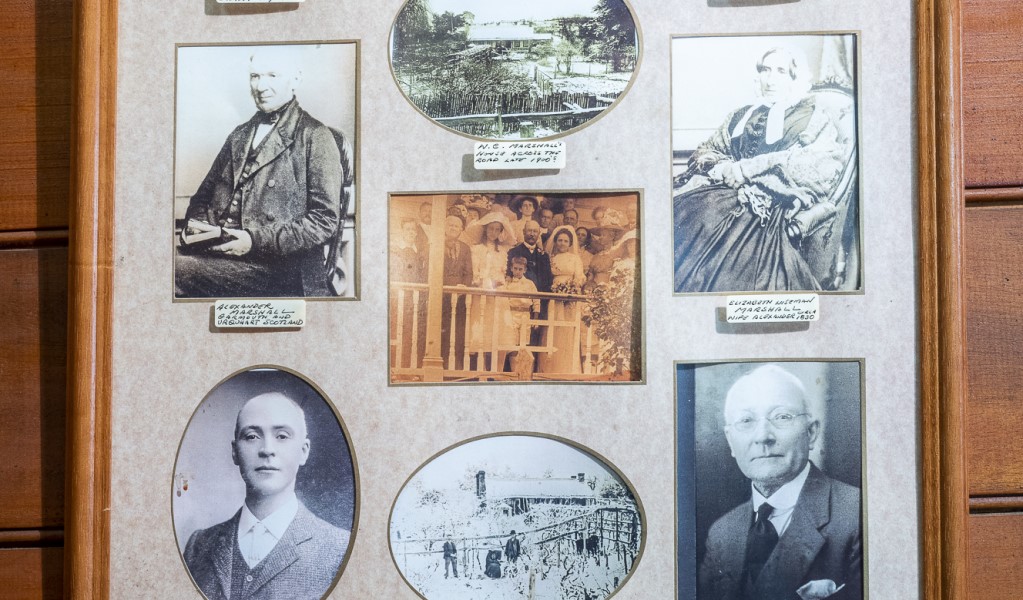 Photos of the Marshall family in a frame on the wall of Craigmoor House. Photo: John Spencer &copy; DPE