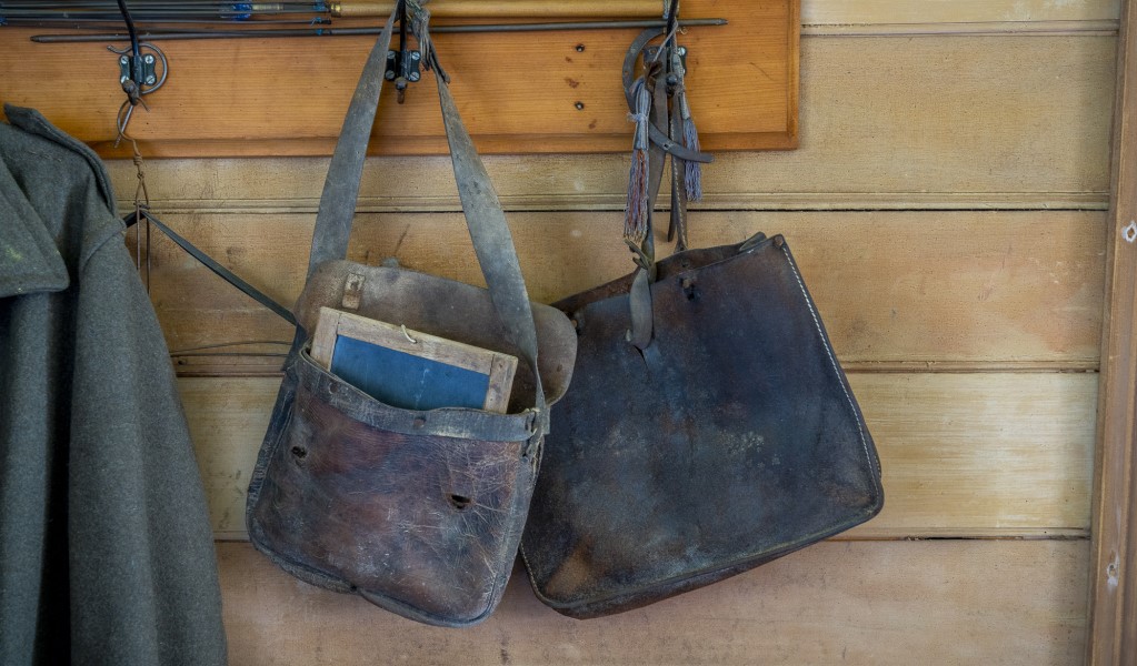 School bags hanging on the wall at Craigmoor House in Hill End Historic Site. Photo: John Spencer &copy; DPE