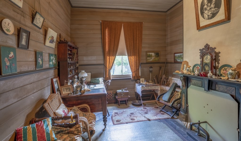 The study with keepsakes and faux marble fireplace at Craigmoor House in Hill End Historic Site. Photo: John Spencer &copy; DPE
