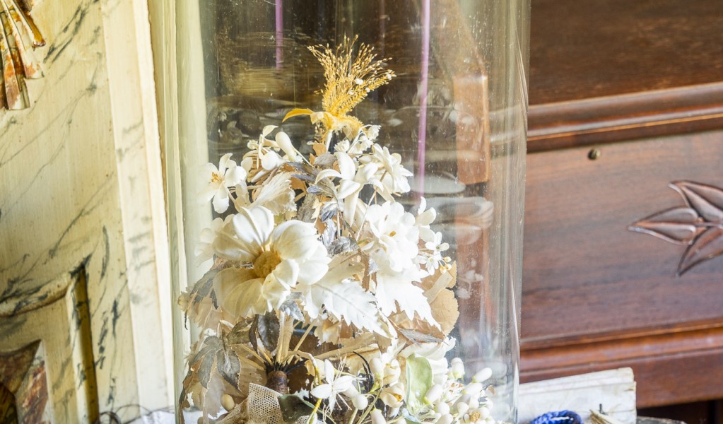 Wedding cake flowers under a glass dome in Craigmoor House, Hill End Historic Site. Photo: John Spencer &copy; DPE